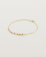 yellow gold Chain featuring seven charms