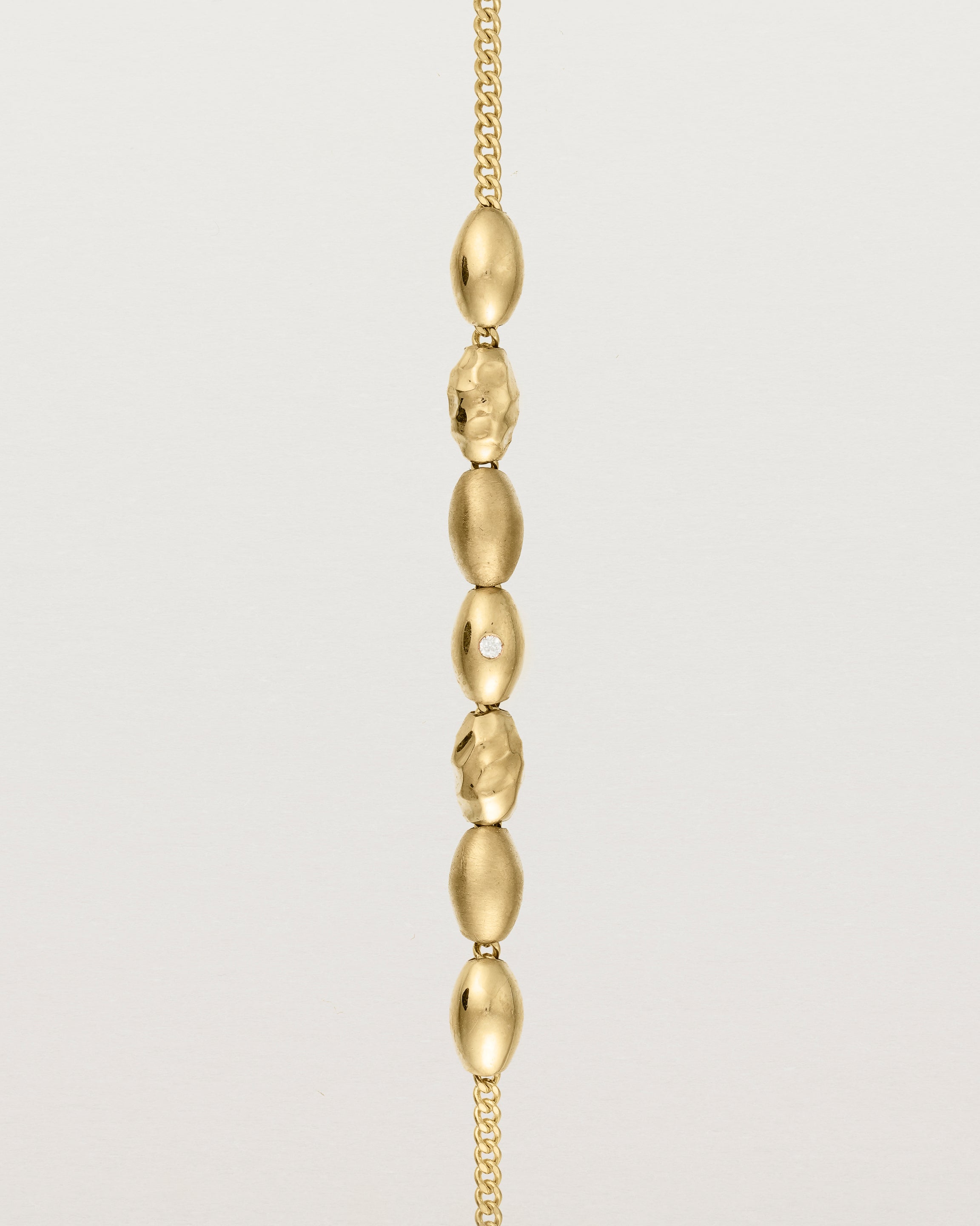 yellow gold Chain featuring seven charms