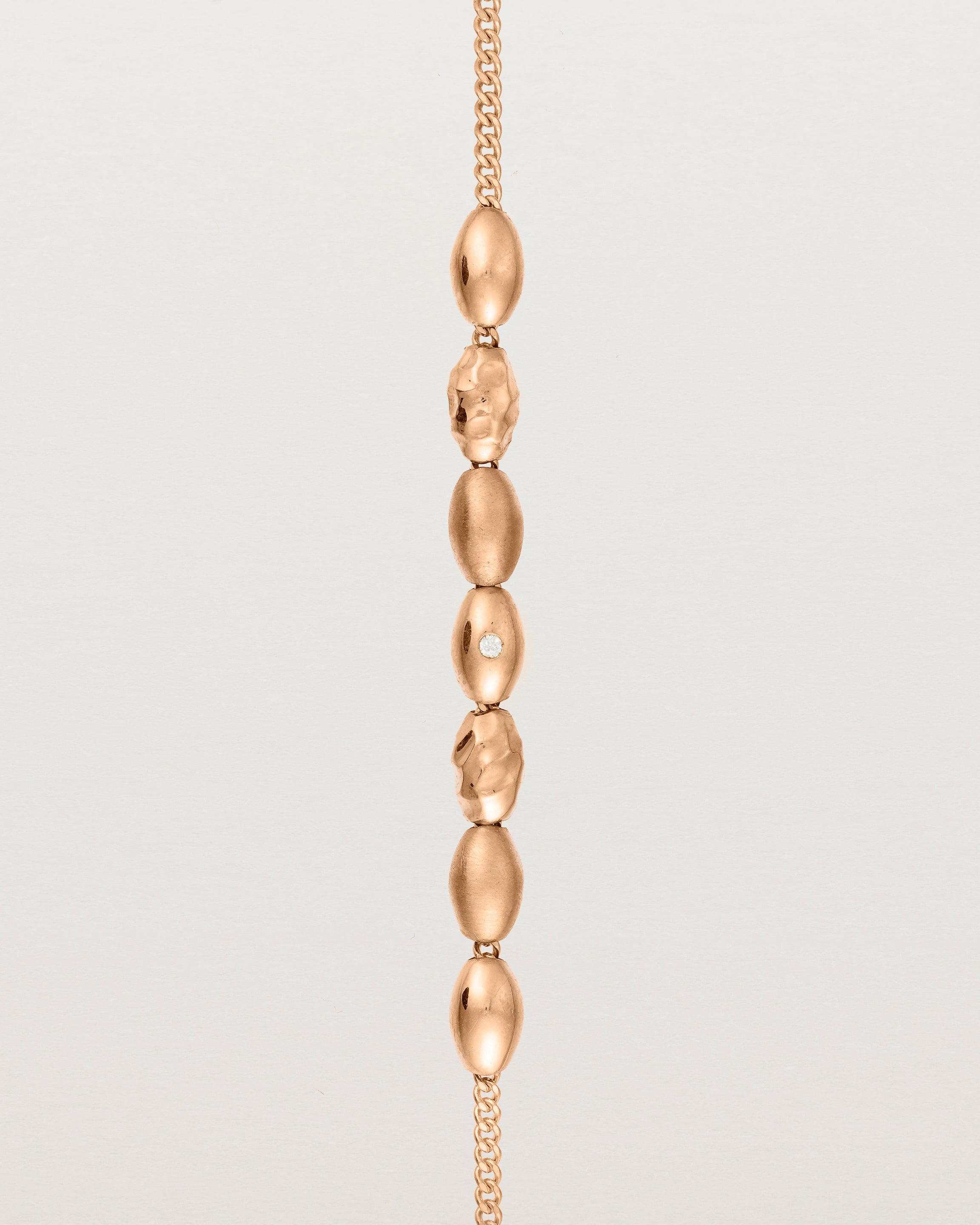 Rose gold Chain featuring seven charms