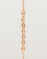 Rose gold Chain featuring seven charms