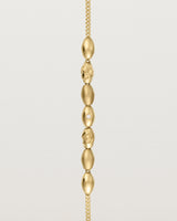 yellow gold Chain featuring seven charms