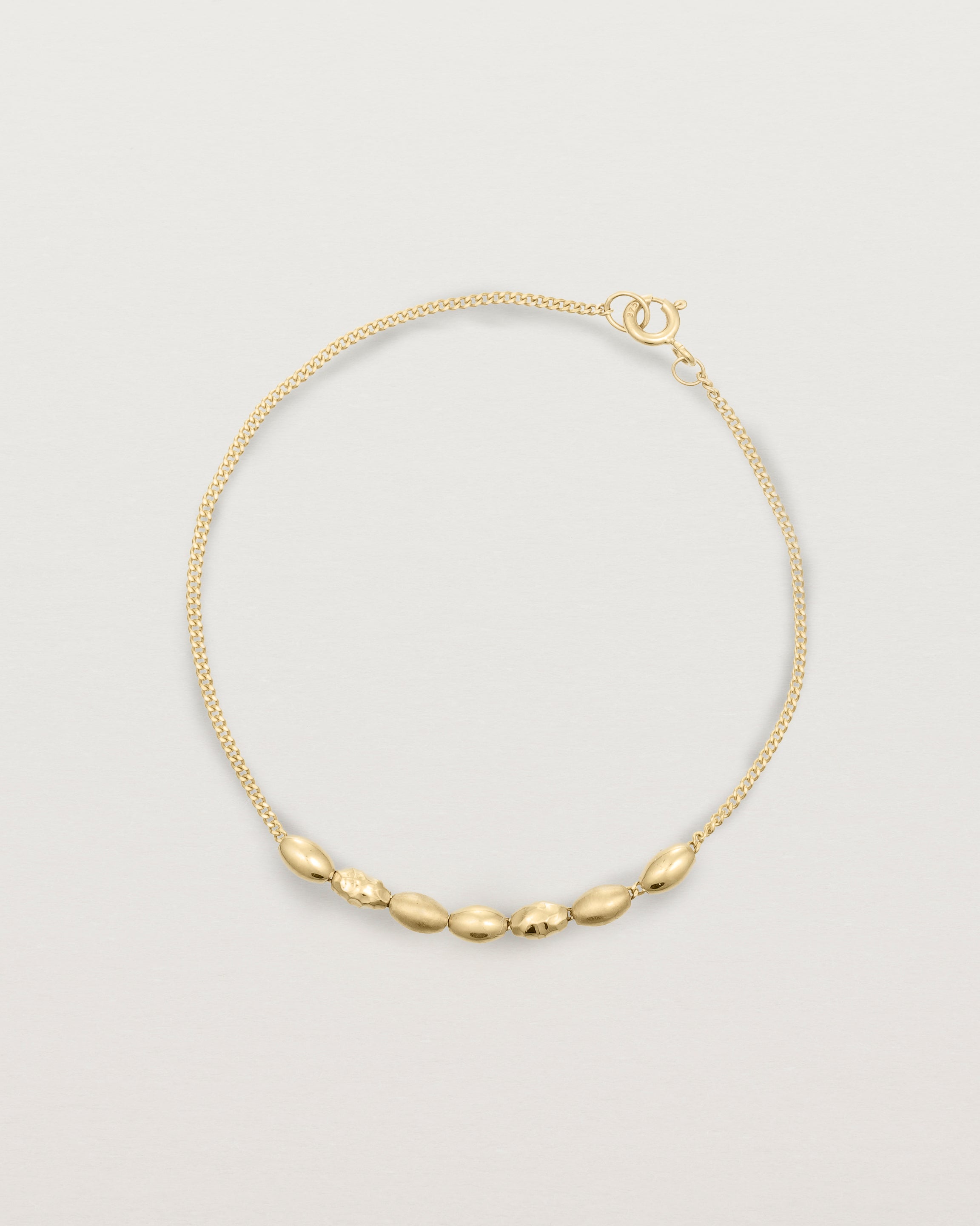 yellow gold Chain featuring seven charms