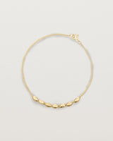 yellow gold Chain featuring seven charms