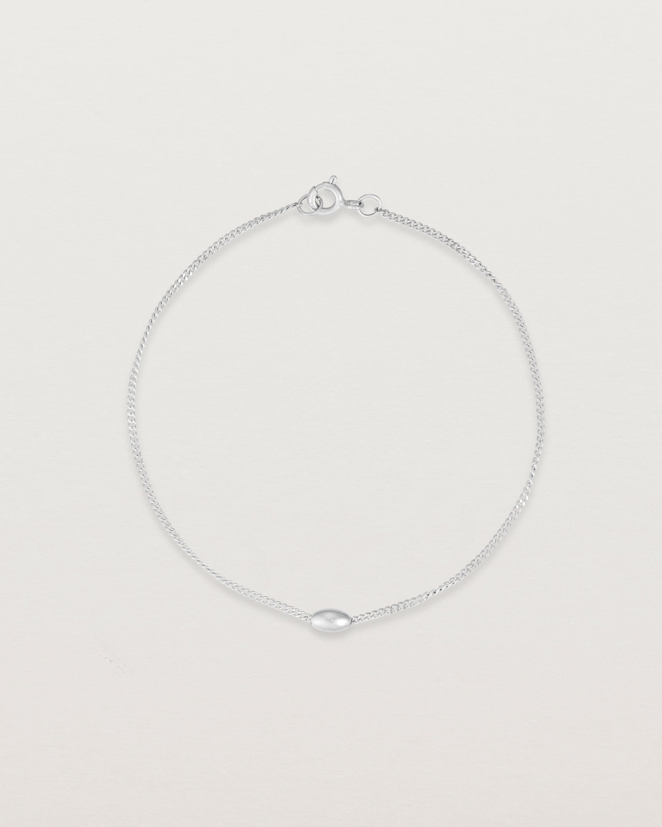 top view of Sonder bracelet in sterling showing one charm