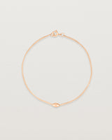 Side view of Sonder bracelet in rose gold showing one charm