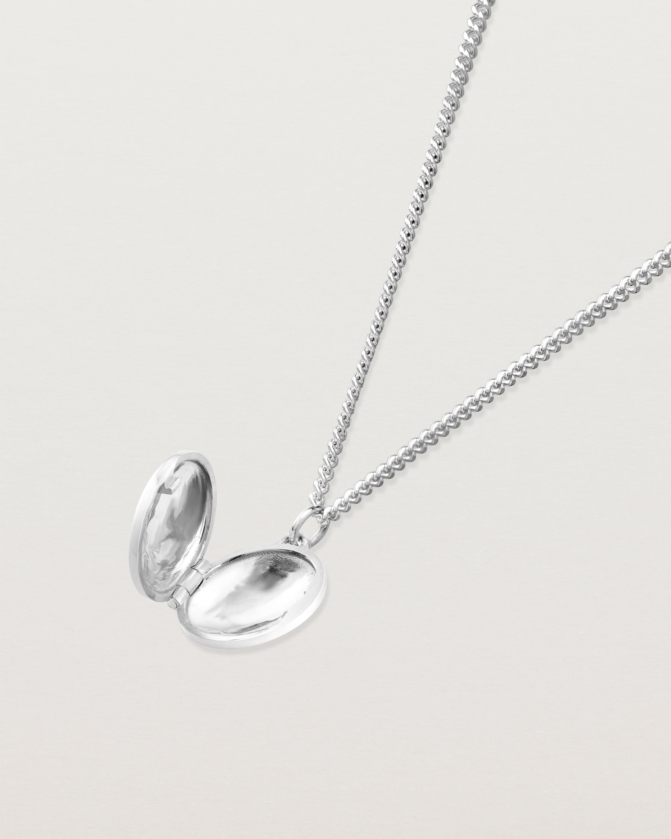 Open view of the Spotted Orchid Locket in sterling silver.