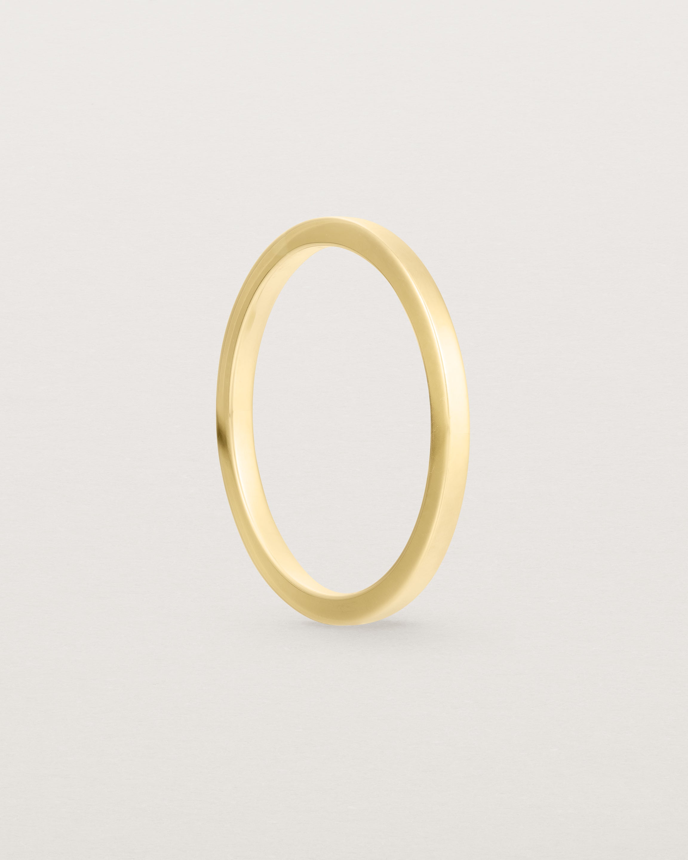 Our 1.5mm square wedding band in yellow gold