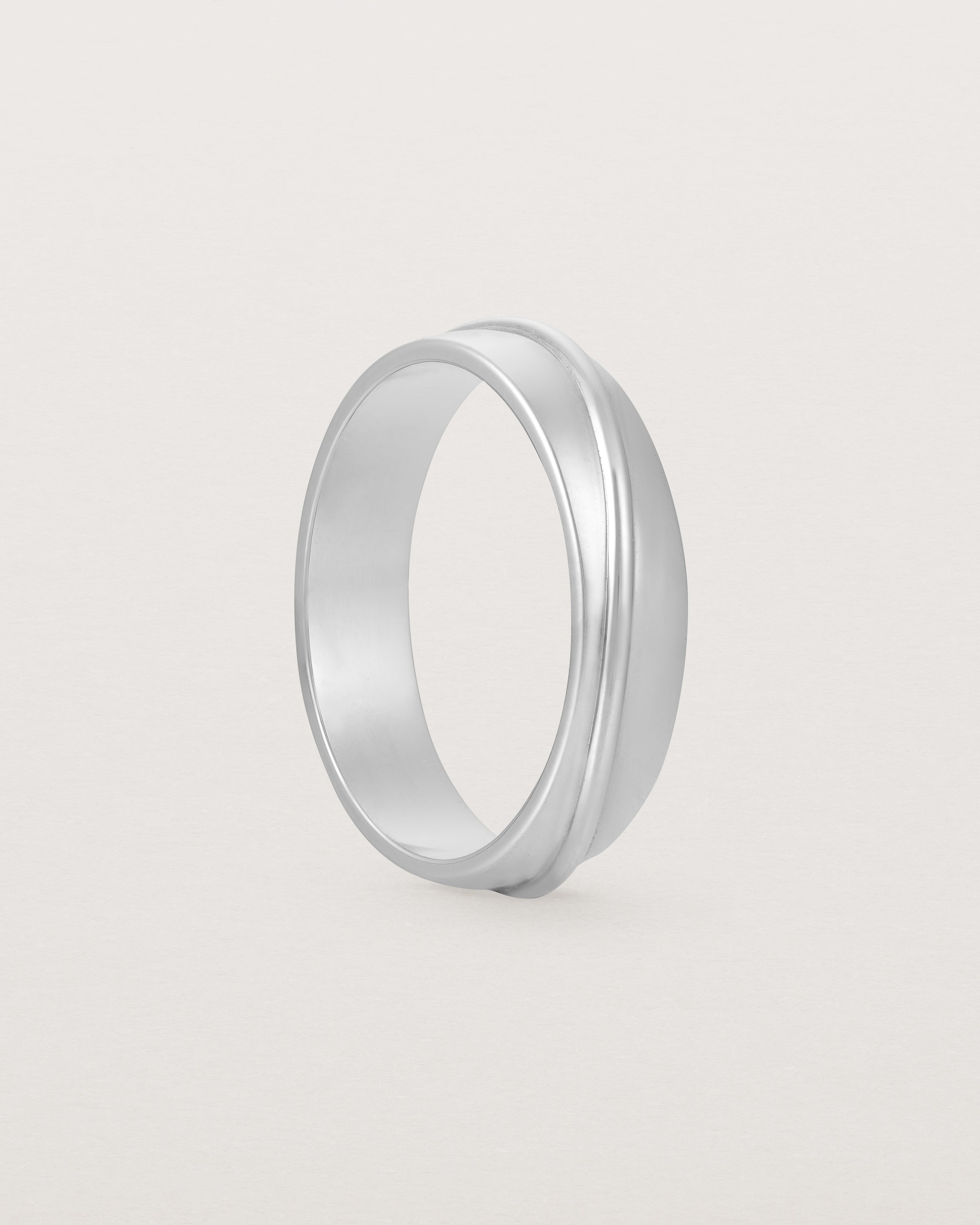 Angled view of the Surge Wedding Ring | 5mm | White Gold.