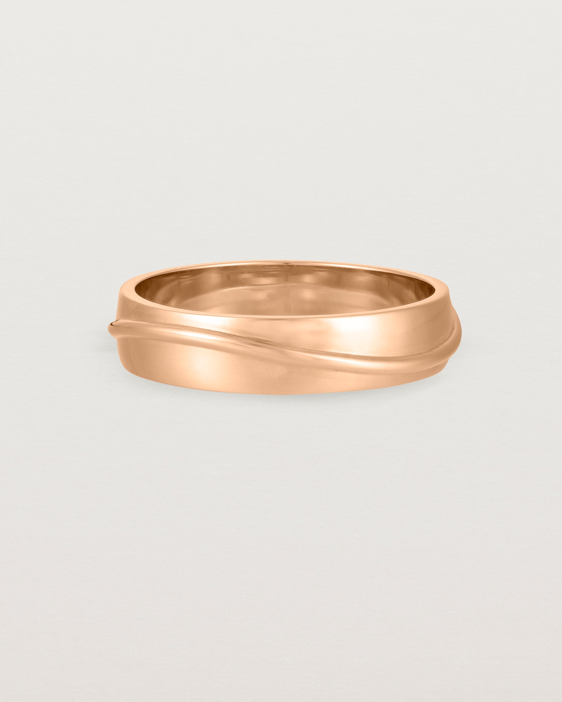 Front view of the Surge Wedding Ring | 5mm | Rose Gold.