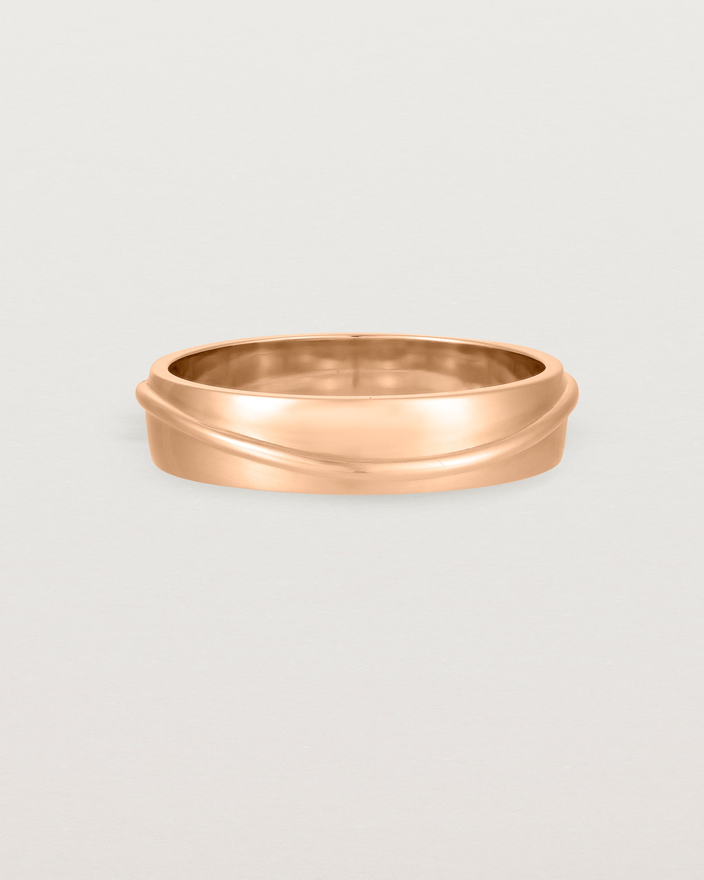 Side view of the Surge Wedding Ring | 5mm | Rose Gold.