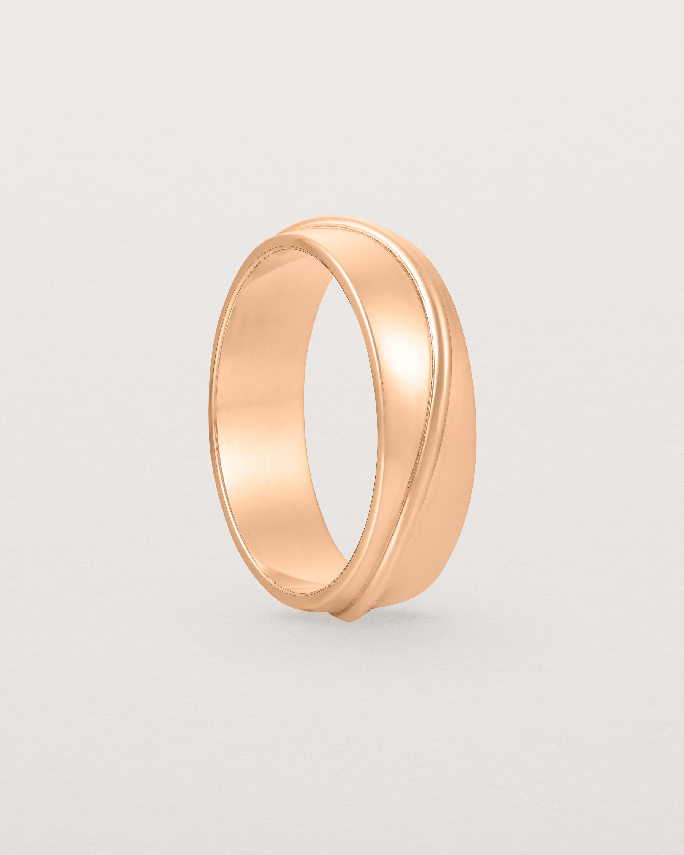 Standing view of the Surge Wedding Ring | 6mm | Rose Gold.