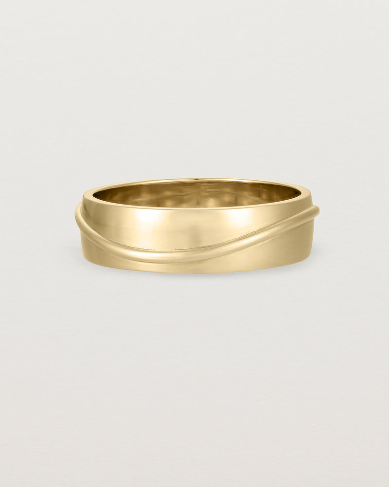 Side view of the Surge Wedding Ring | 6mm | Yellow Gold.