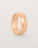 Standing view of the Surge Wedding Ring | 7mm | Rose Gold.