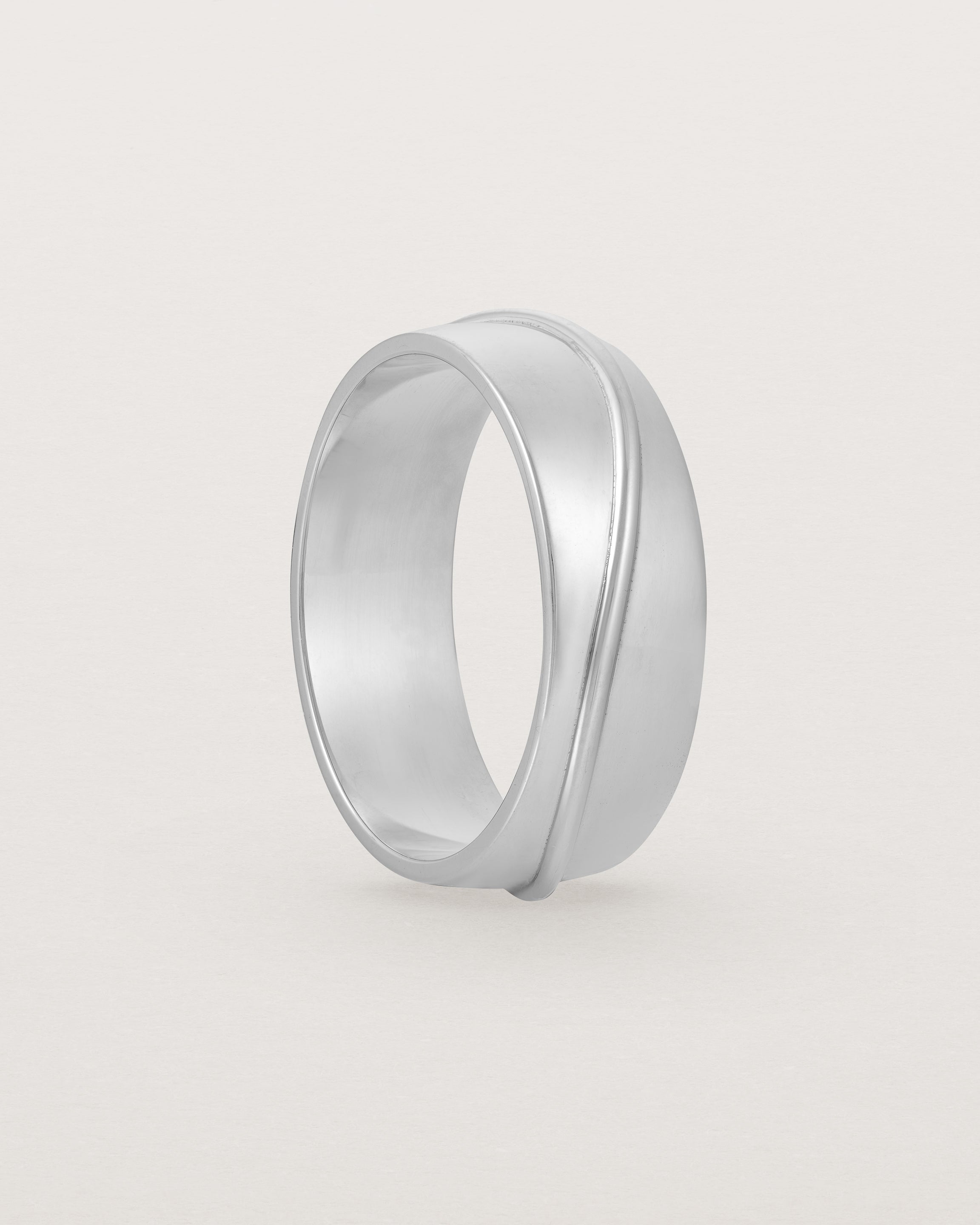 Angled view of the Surge Wedding Ring | 7mm | White Gold.