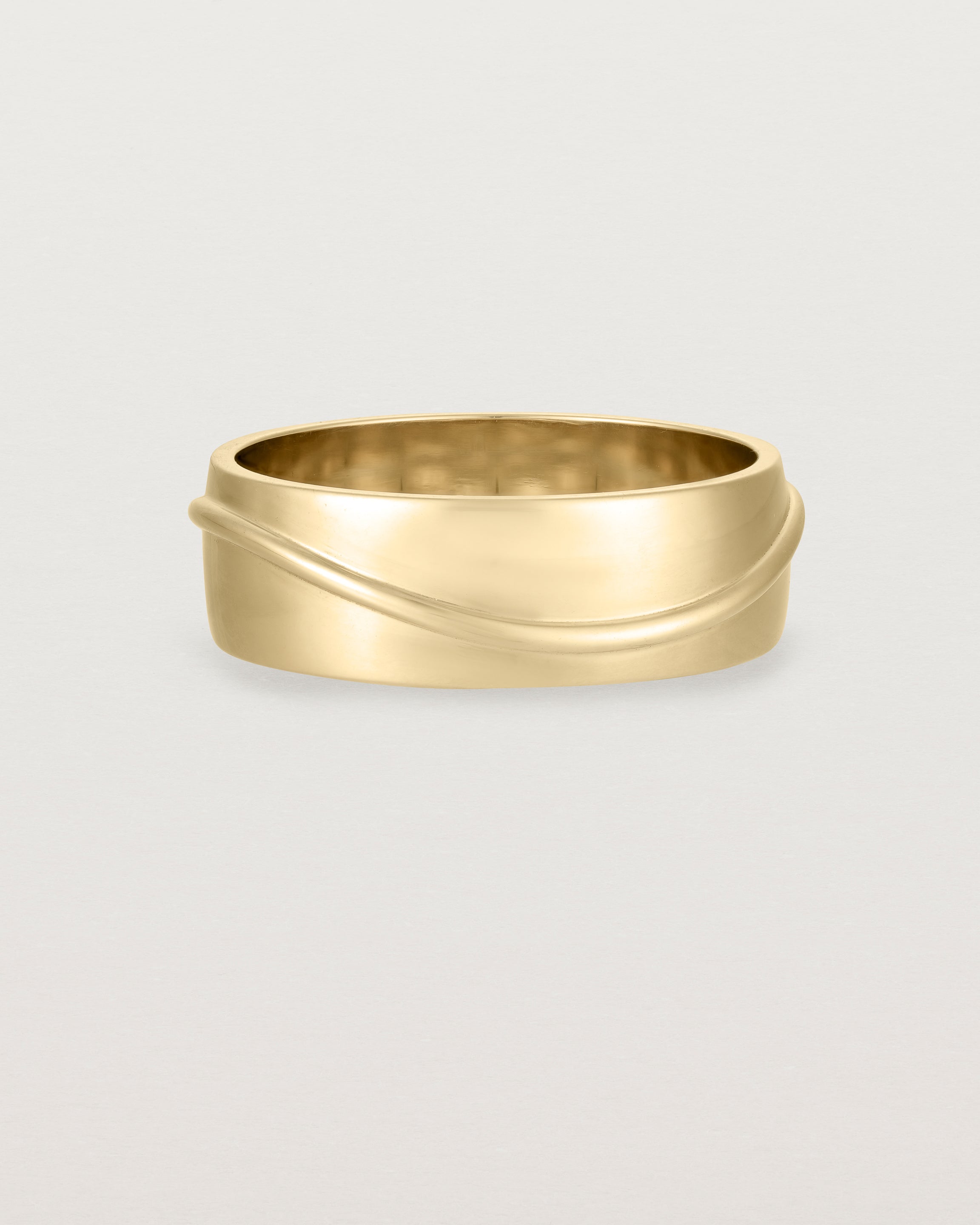 Front view of the Surge Wedding Ring | 7mm | Yellow Gold.