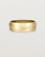 Angled view of the Surge Wedding Ring | 7mm | Yellow Gold.