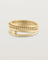 Angled view of the Textured Curated Ring Set in yellow gold.