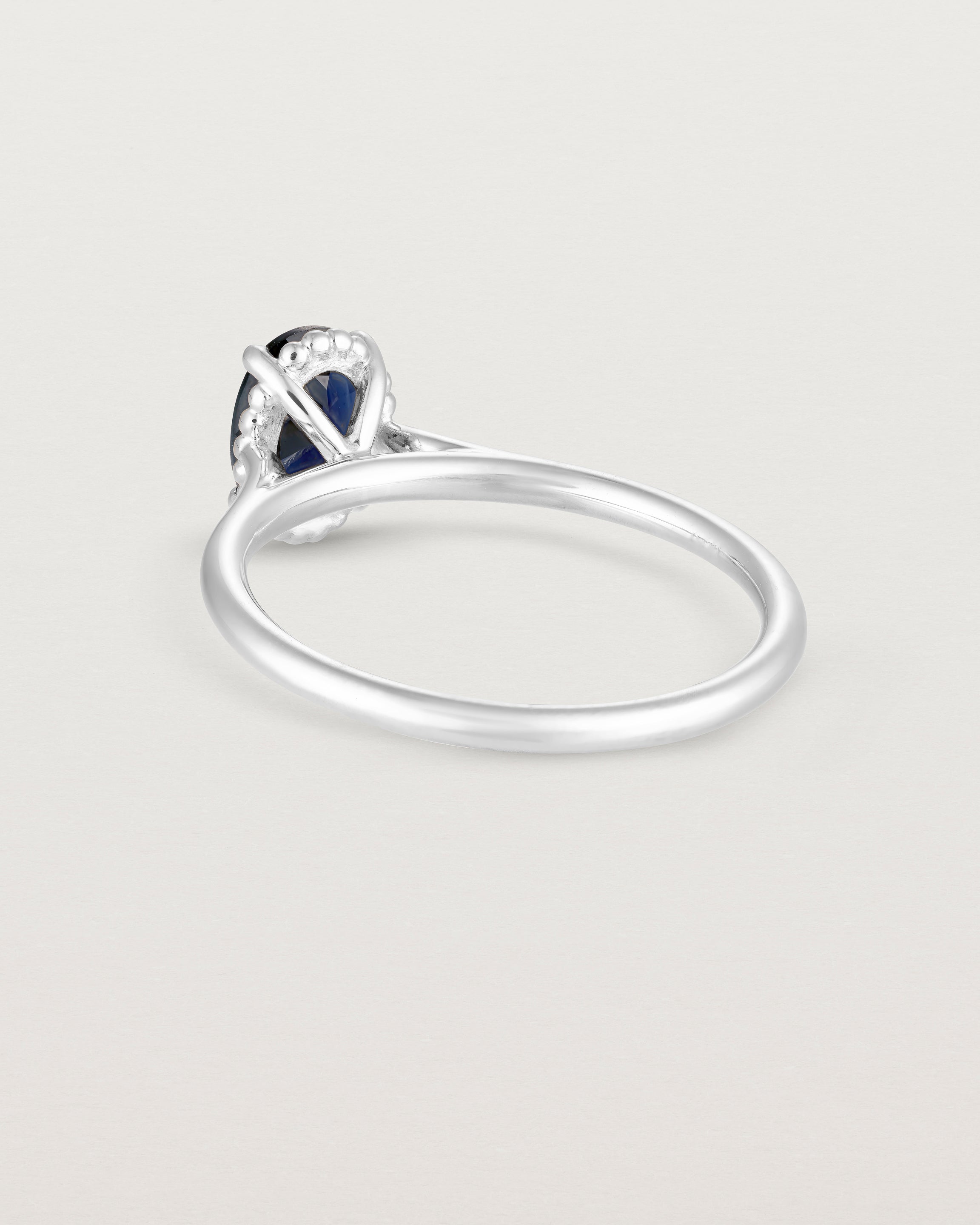 A back view of the Thea Oval Solitaire with a deep blue Australian Sapphire set in White Gold