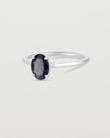 A side view of the Thea Oval Solitaire with a deep blue Australian Sapphire set in White Gold