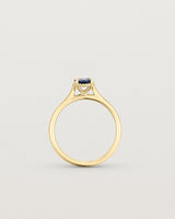 A side profile of the Thea Oval Solitaire with a deep blue Australian Sapphire in Yellow Gold