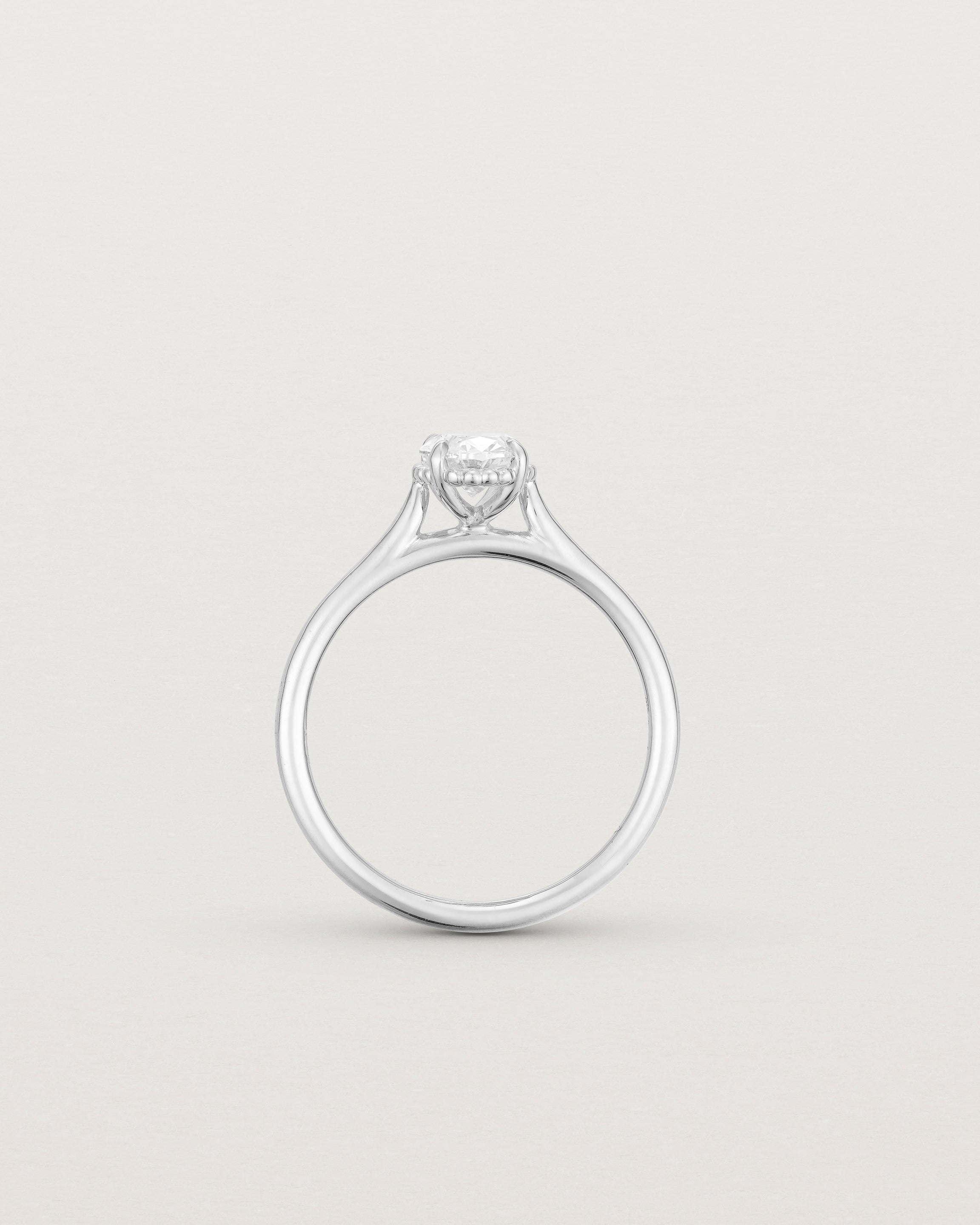 A side profile of the Thea Oval Solitaire with a white Laboratory Grown Diamond in White Gold
