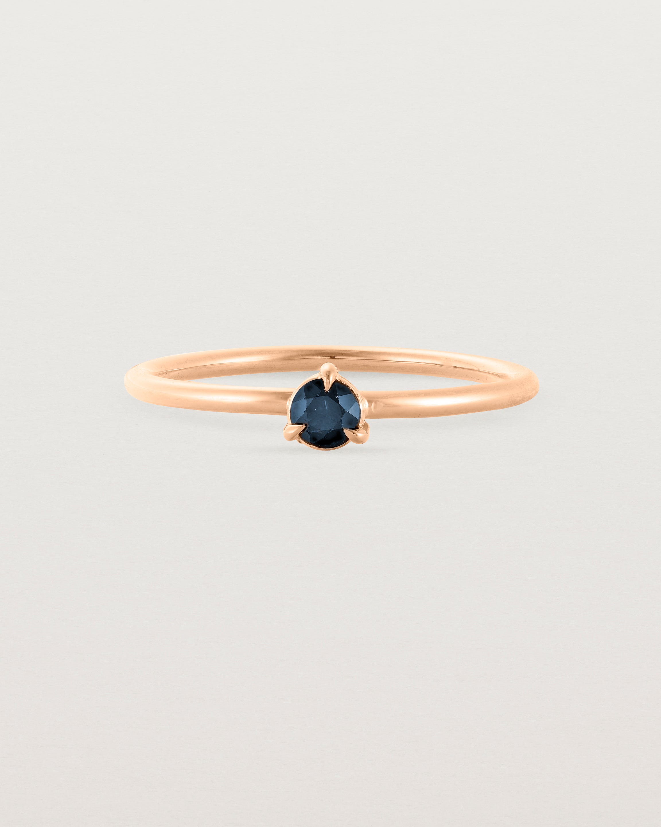 Front view of the Thea Petite Solitaire | Sapphire | Rose Gold.