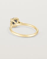 A back view of the the Thea Round Solitaire with a deep blue Australian Sapphire in Yellow Gold