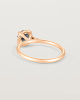 A back view of the Thea Round Solitaire with a deep blue Australian Sapphire in Rose Gold