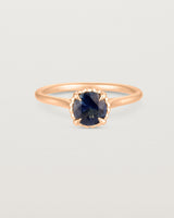 A front view of the Thea Round Solitaire with a deep blue Australian Sapphire in Rose Gold