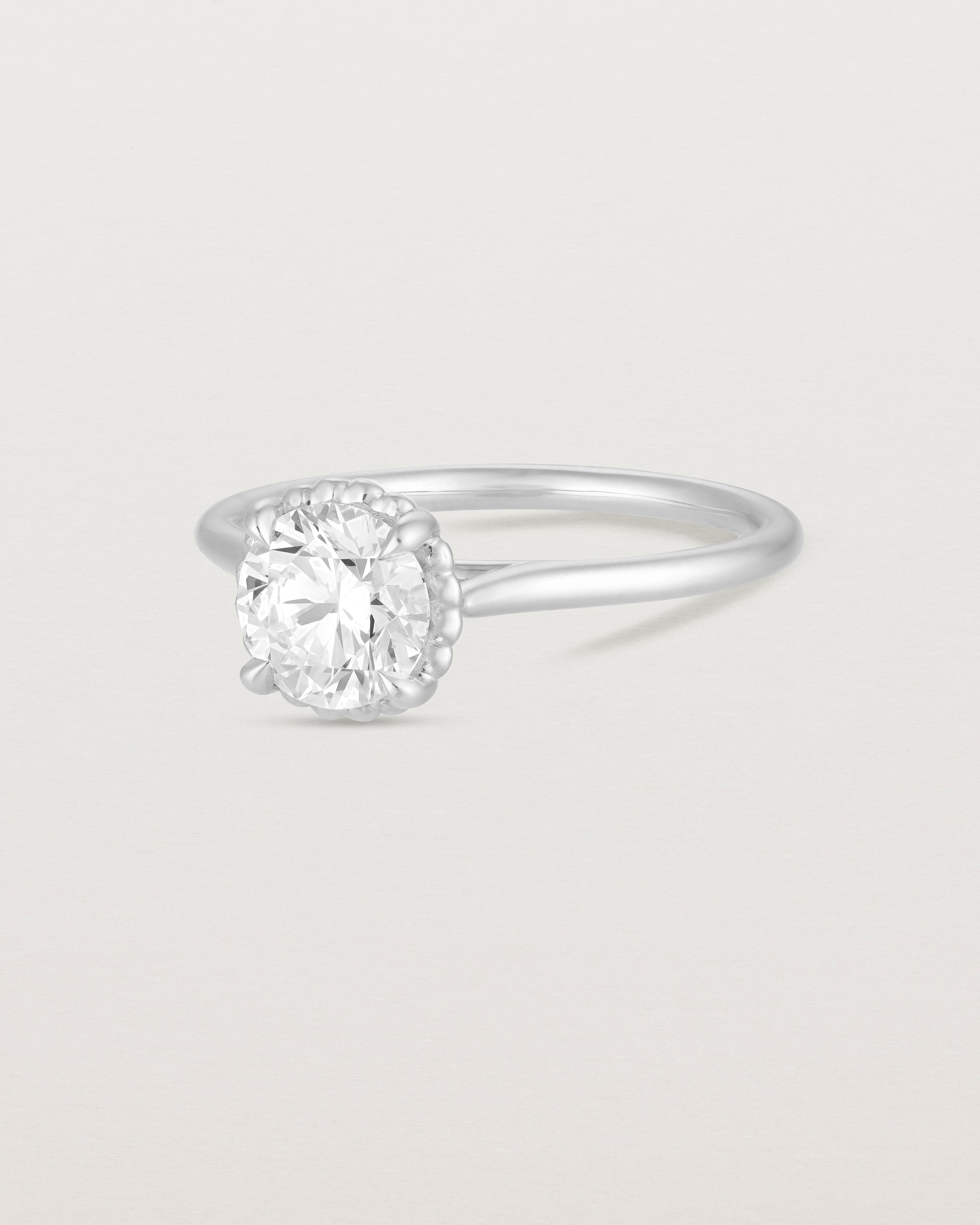 A side view of the Thea Round Solitaire with a white Laboratory Grown Diamond in White Gold