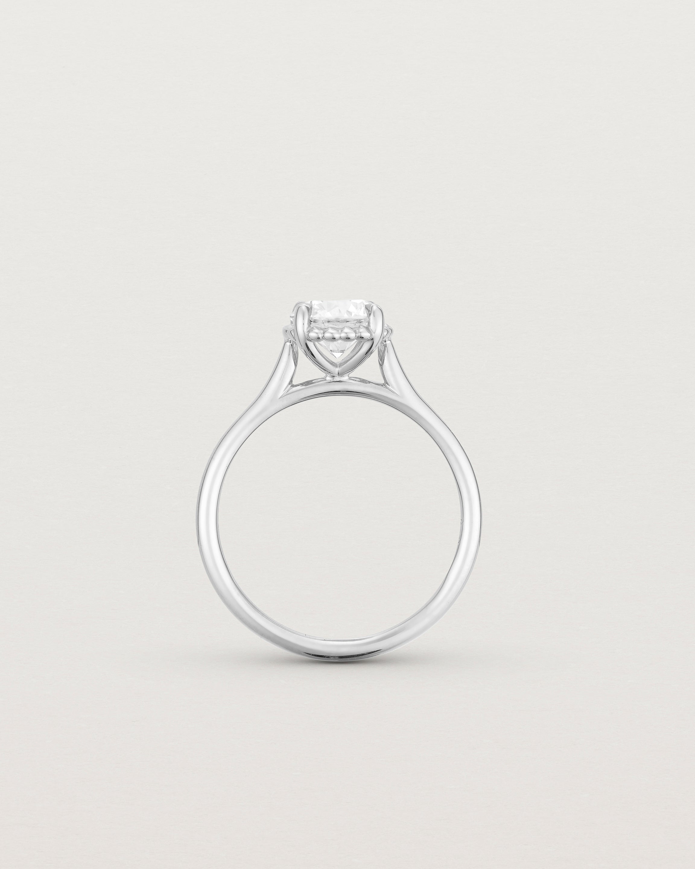 A side profile of the Thea Round Solitaire with a white Laboratory Grown Diamond in White Gold
