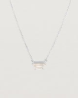 Close up view of the Tiny Half Moon Pendant | Moonstone in sterling silver.