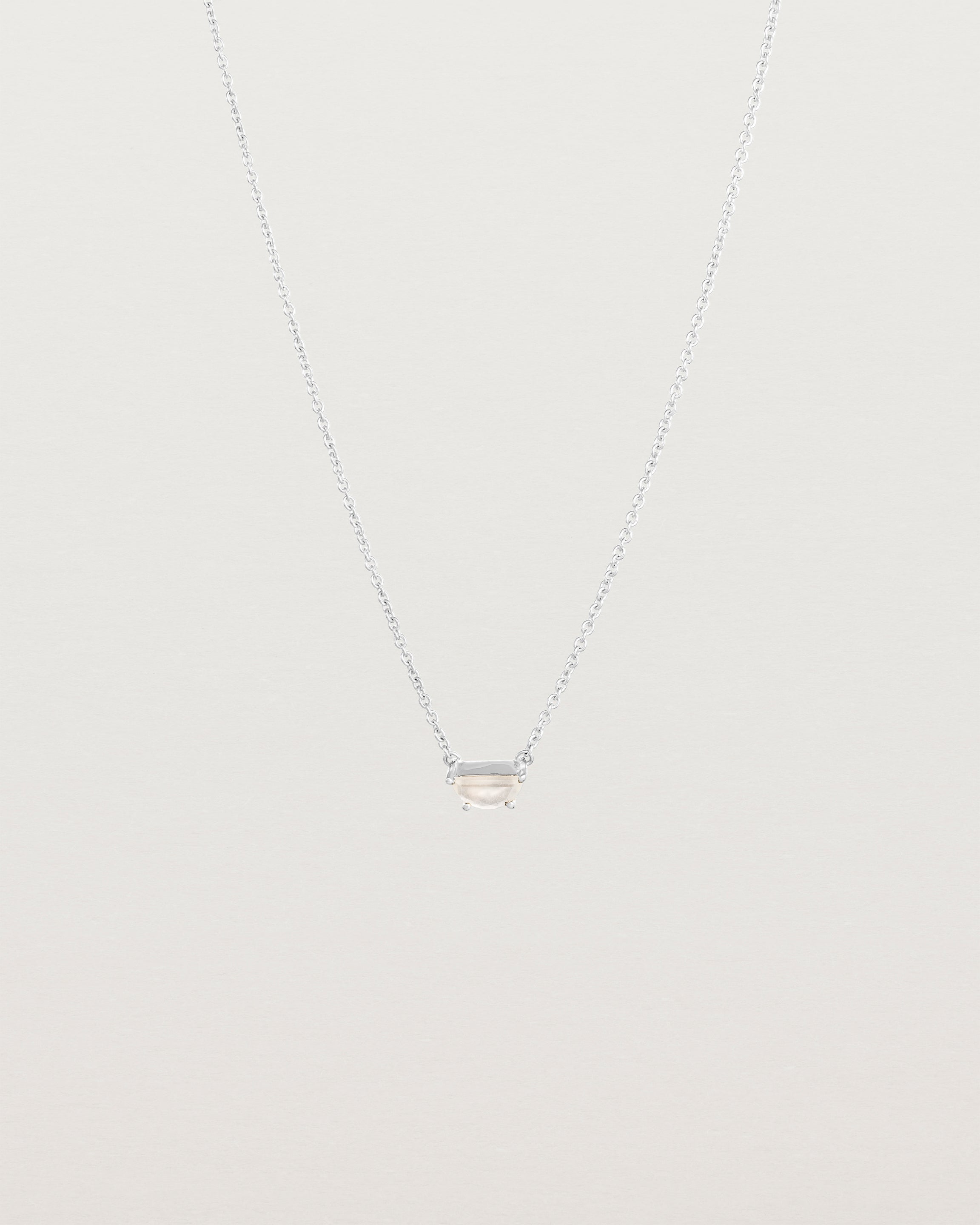 Front view of the Tiny Half Moon Pendant | Moonstone in sterling silver.