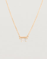 Close up view of the Tiny Half Moon Pendant | Moonstone in rose gold.