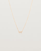 Front view of the Tiny Half Moon Pendant | Moonstone in rose gold.