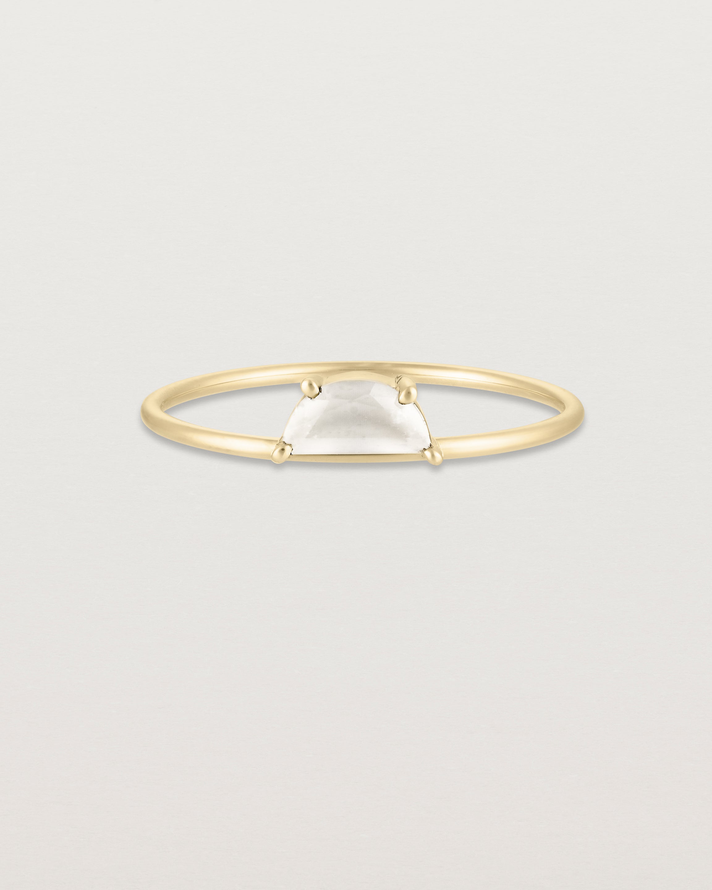 Front view of the Tiny Half Moon Ring | Moonstone in yellow gold.