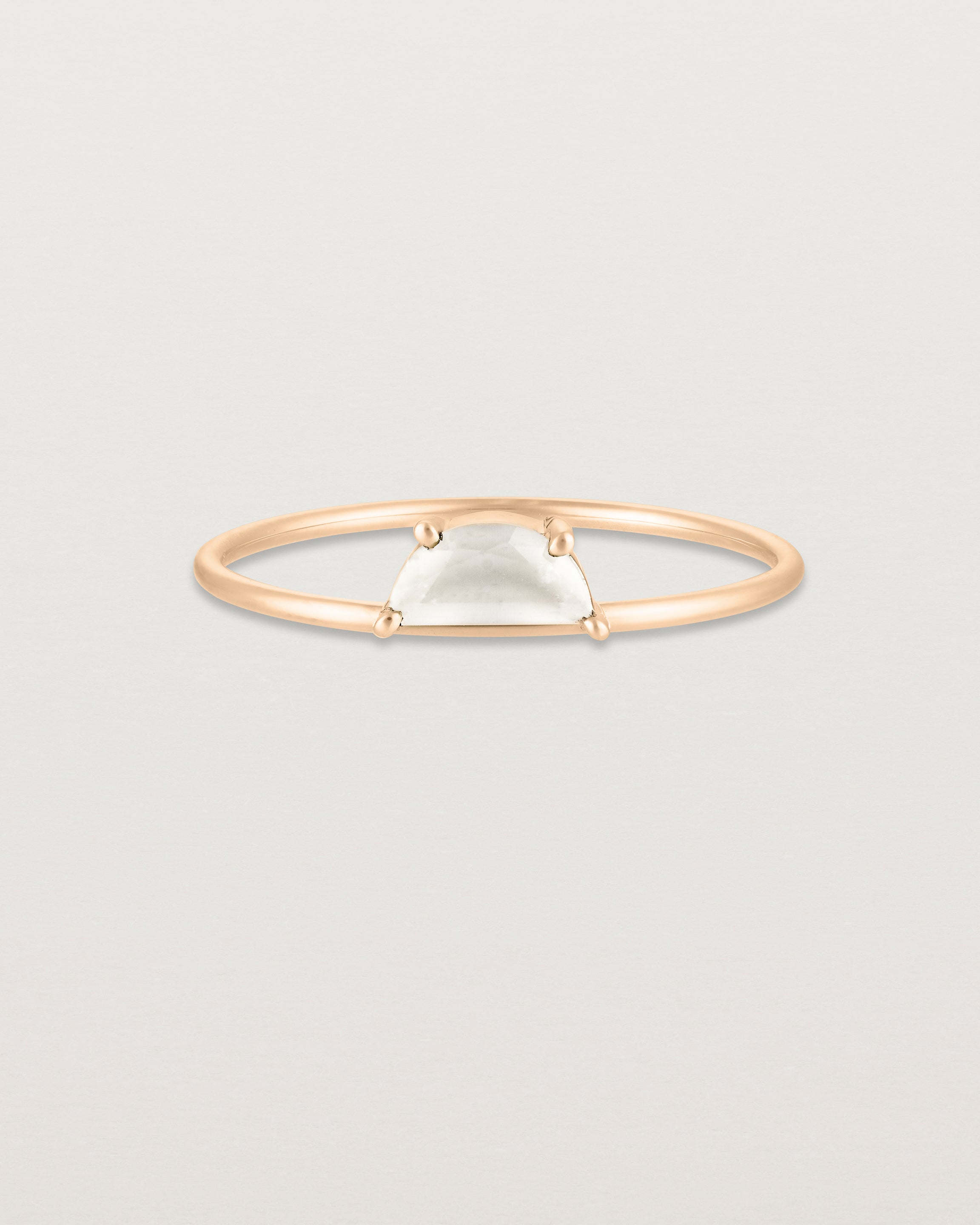 Front view of the Tiny Half Moon Ring | Moonstone in rose gold.