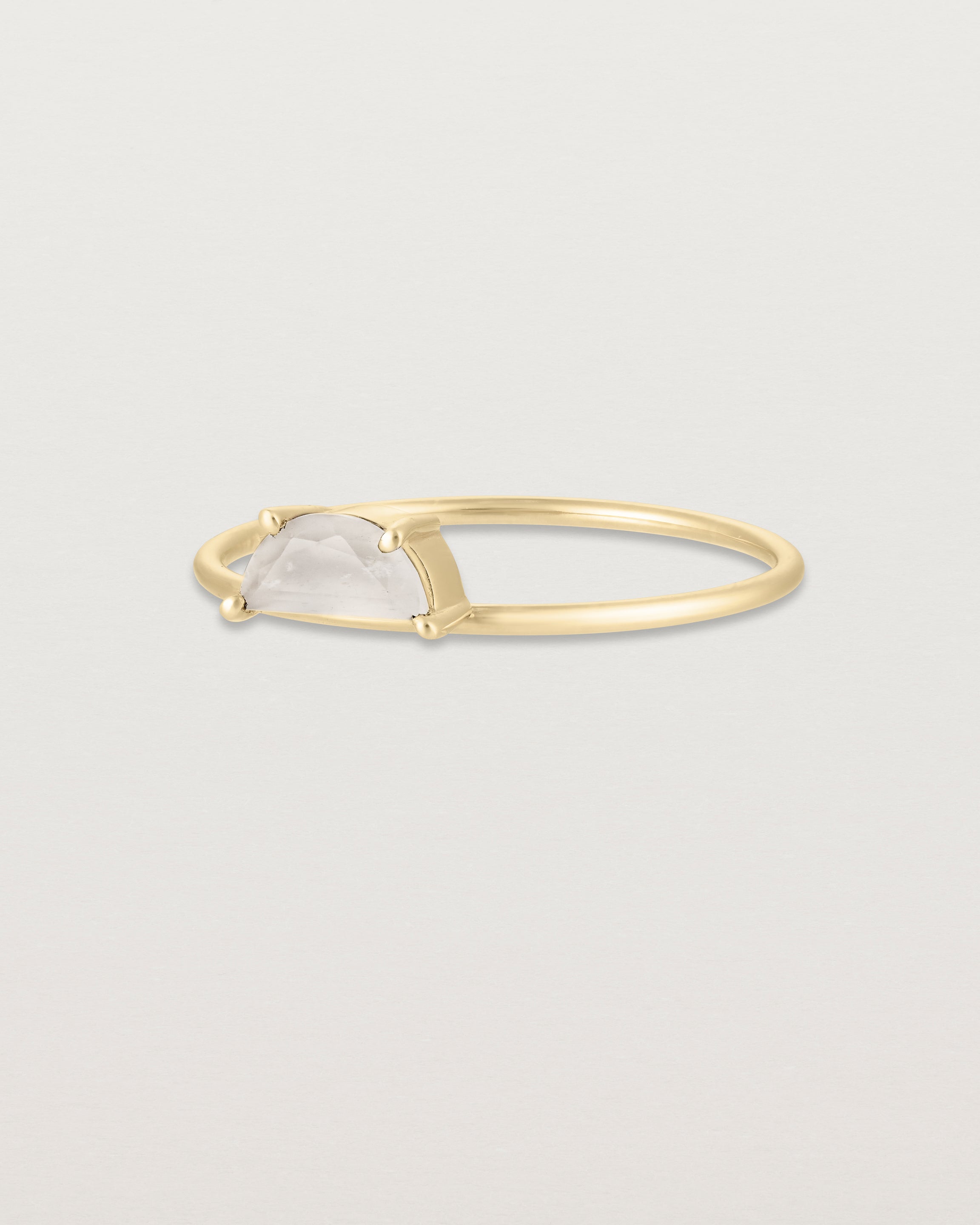 Angled view of the Tiny Half Moon Ring | Moonstone in yellow gold.