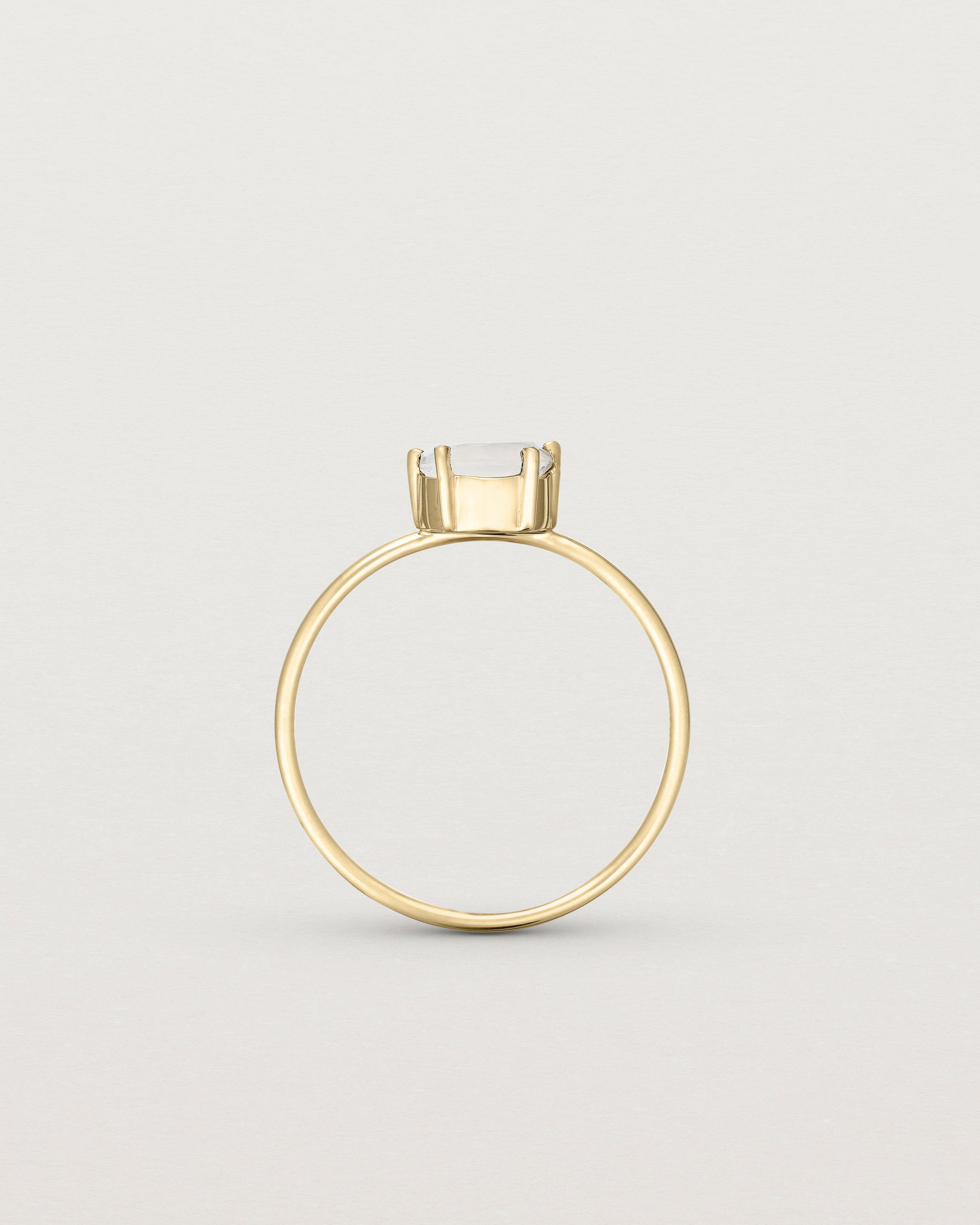 Standing view of the Tiny Half Moon Ring | Moonstone in yellow gold.