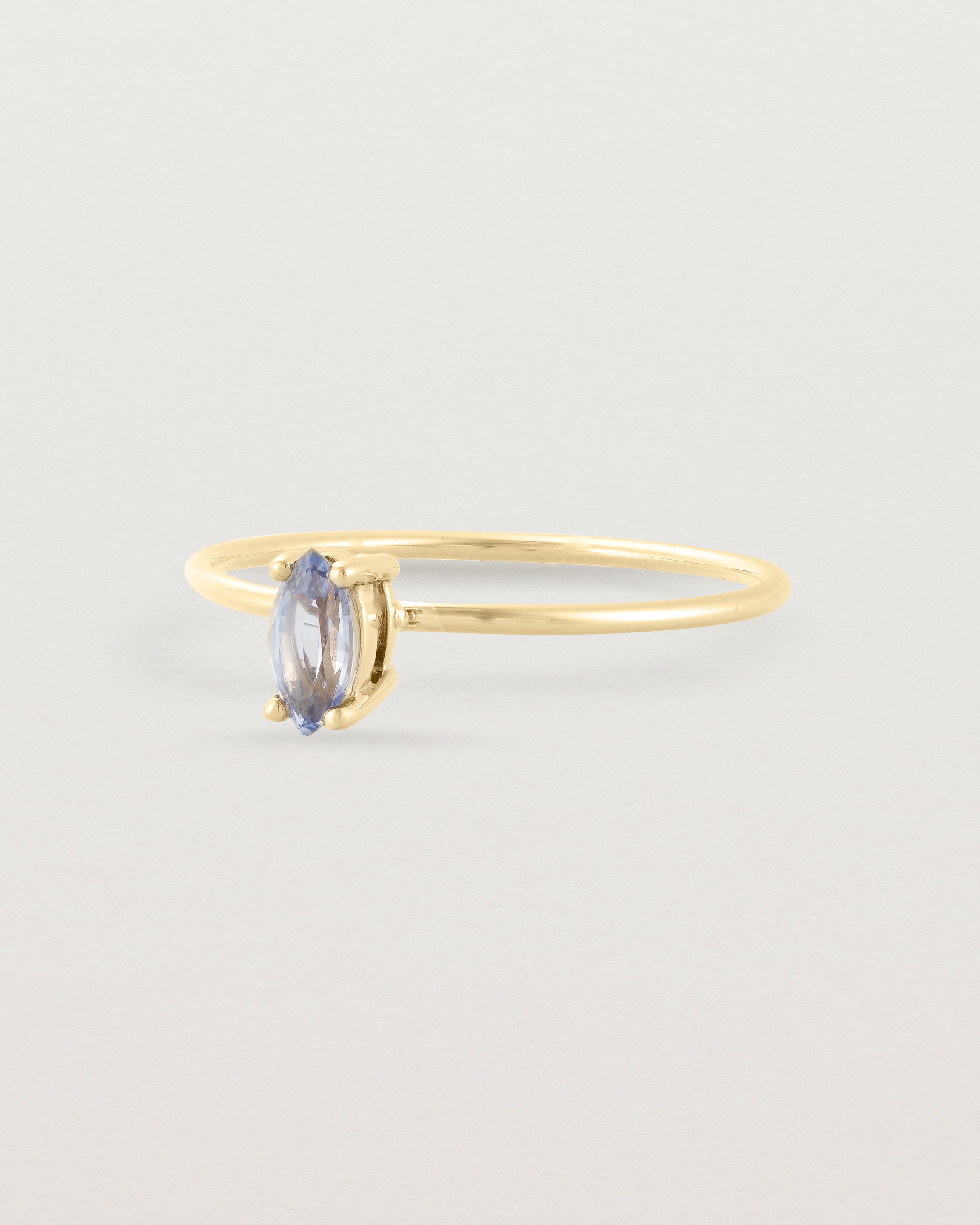 Angled view of the Tiny Marquise Ring | Sapphire | Yellow Gold