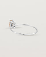 Fine white gold band featuring a marquise cut brown rutilated quartz stone