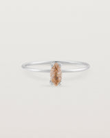 Fine white gold band featuring a marquise cut brown rutilated quartz stone