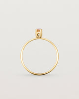 Fine yellow gold band featuring a marquise cut brown rutilated quartz stone