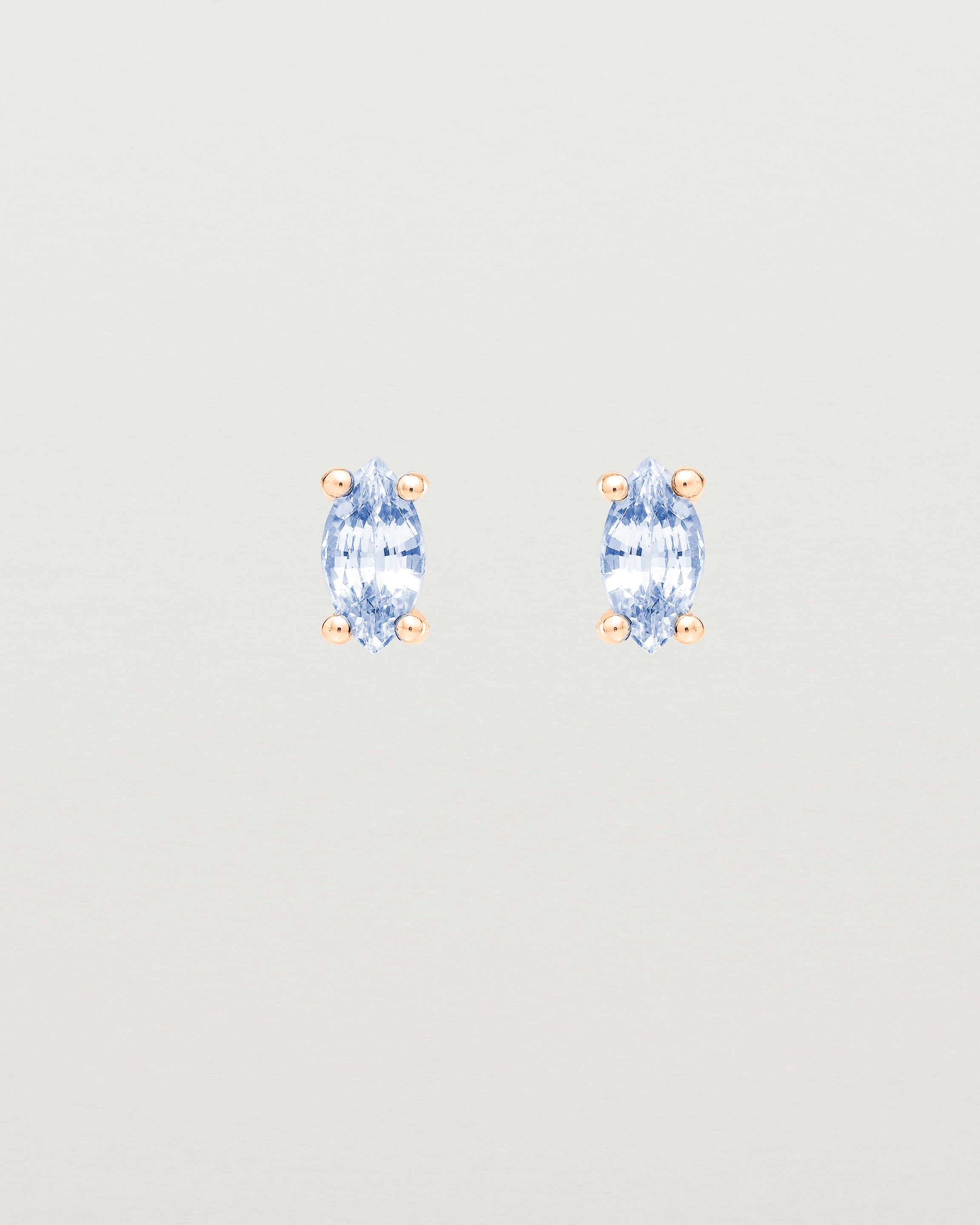 Front view of the Tiny Marquise Studs | Sapphire | Rose Gold.