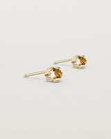 Angled view of the Tiny Rose Cut Studs | Honey Quartz in yellow gold.