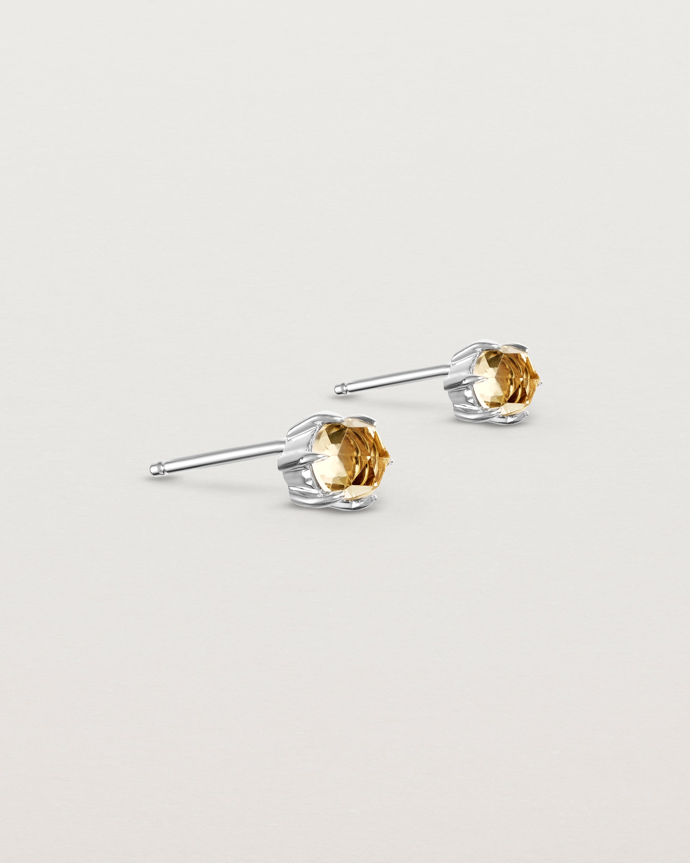 Angled view of the Tiny Rose Cut Studs | Honey Quartz in white gold.
