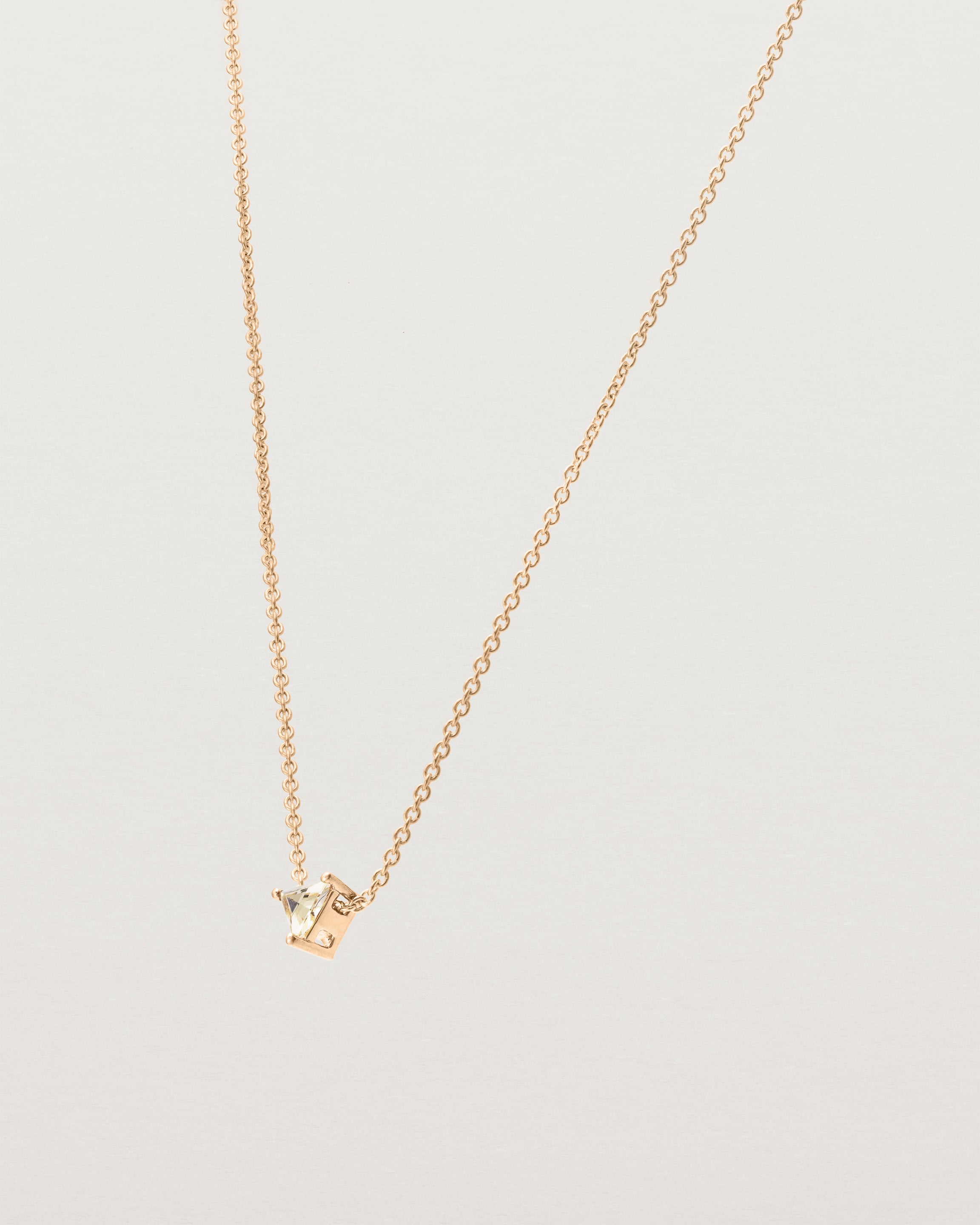 Angled view of the Tiny Trillion Necklace with Heliodor in Rose Gold.