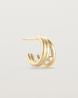 A single Triple Reliquum Hoop in yellow gold.