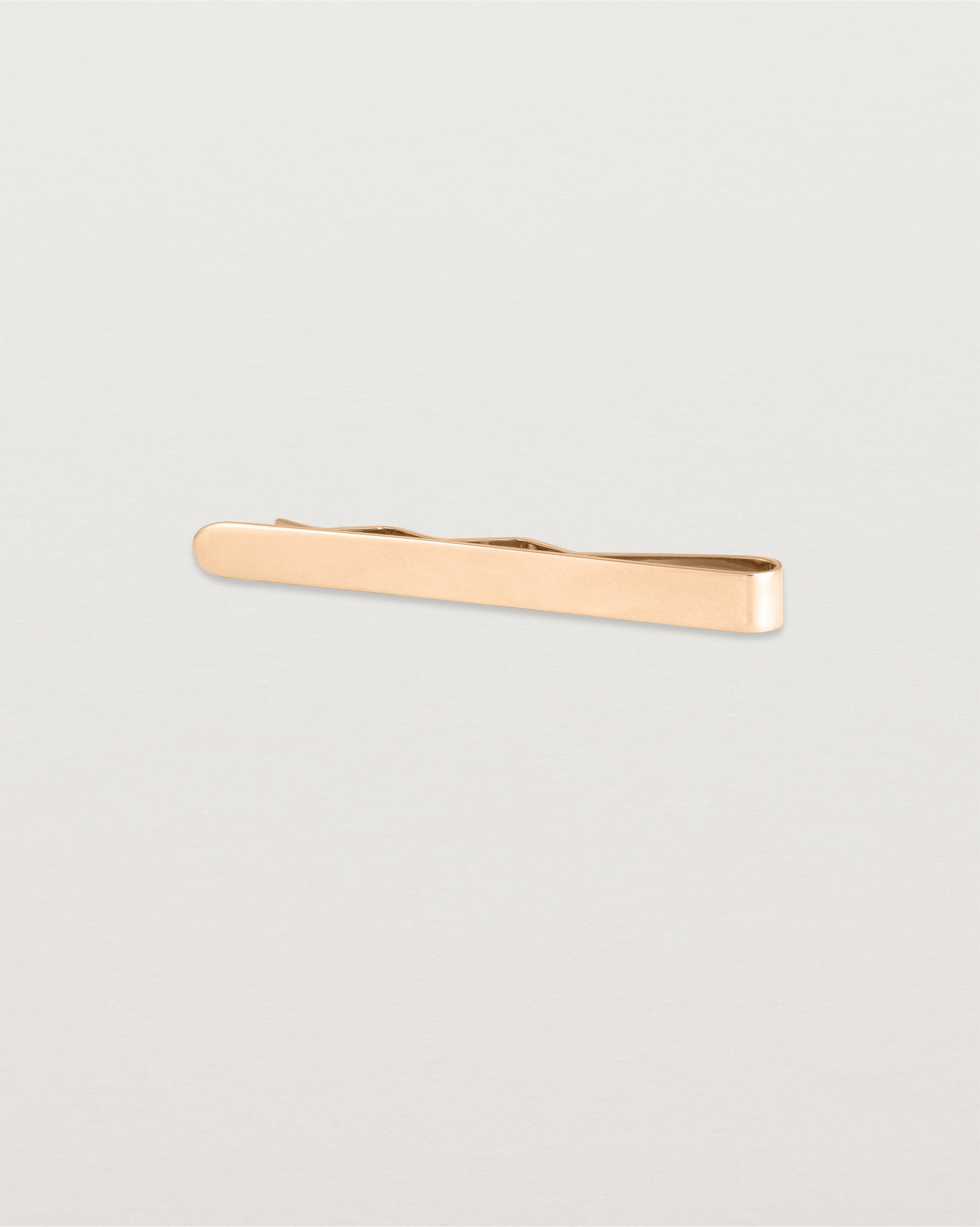 The Turas Tie Bar in Rose Gold.