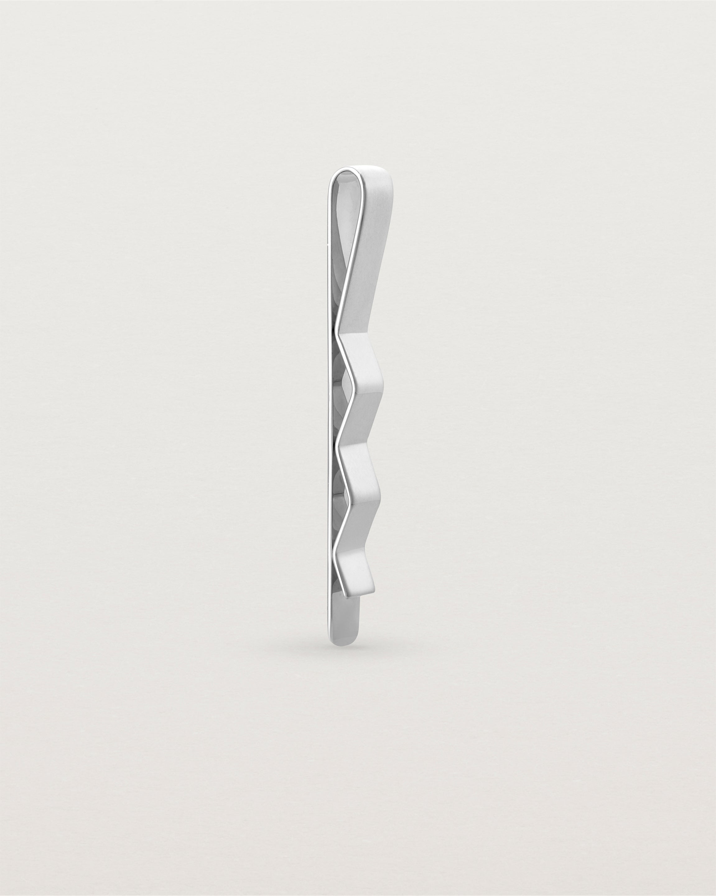 The Turas Tie Bar in Sterling Silver standing.